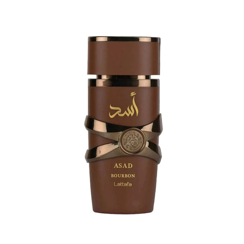 A brown cylindrical bottle of Asad Bourbon Lattafa fragrance with metallic gold accents, Arabic calligraphy, and a central round emblem, shown against a black background.