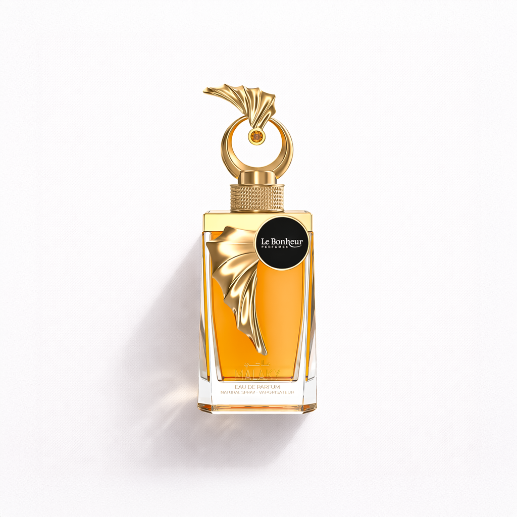 Perfume bottle with gold cap and label on a white background
