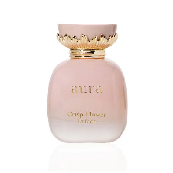 A pink glass perfume bottle with a gold leaf cap labeled aura crisp flower la fede from aura crisp flower khadlaj edp 100ml