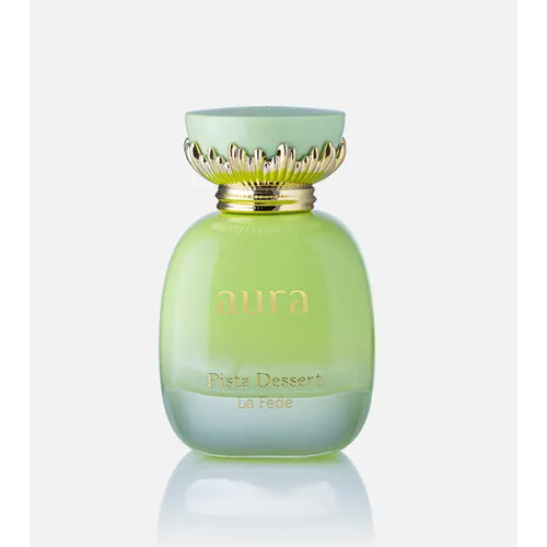 A pale green glass perfume bottle with a gold leaf cap and aura branding for aura pista dessert khadlaj edp 100ml