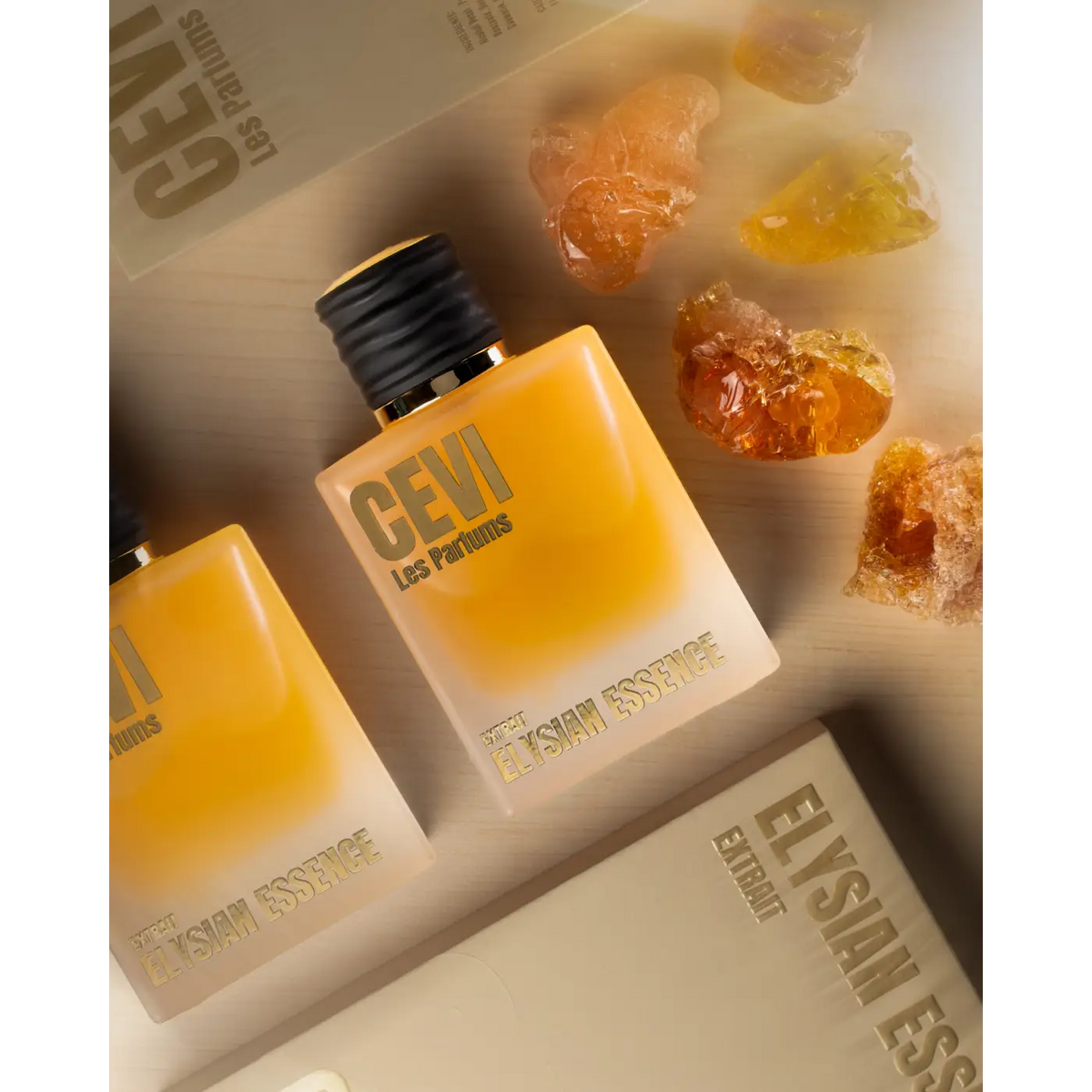 A sleek rectangular amber glass bottle of Elysian Essence CEVI EDP 100ml perfume with black ribbed cap and gold accents