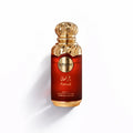 A luxurious red glass perfume bottle with ornate gold cap and base featuring le bonheur farsah fragrance label