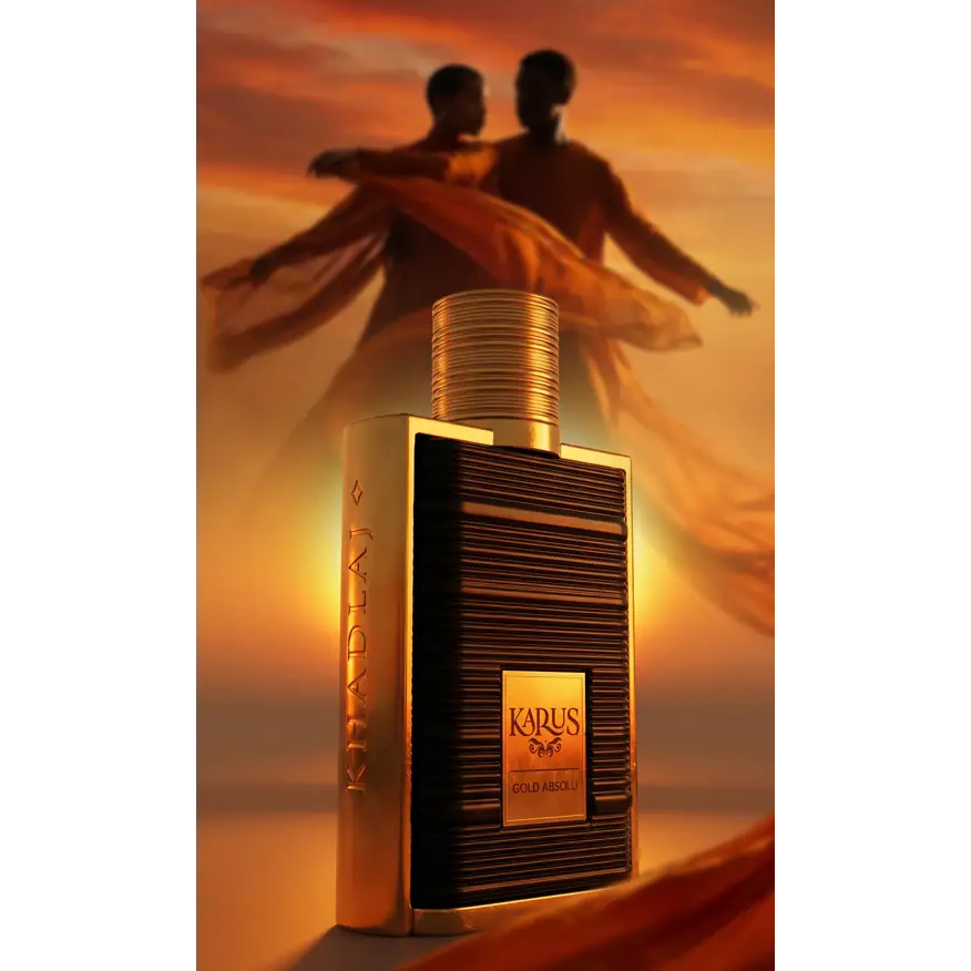 A sleek rectangular karus gold absolu edp 100ml perfume bottle with dark textured body and gold accents