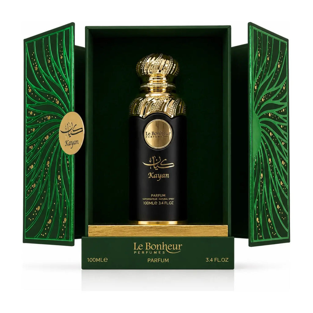 A luxurious black perfume bottle with a golden ornate cap and embossed gold lettering in an elegant green box for kayan le bonheur edp 100ml