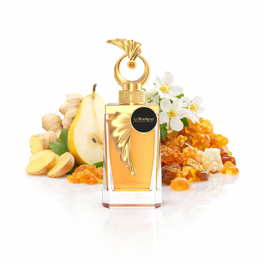 Golden leaf-shaped perfume bottle with amber liquid gold cap and black le bonheur parfums label malaky edp 100ml