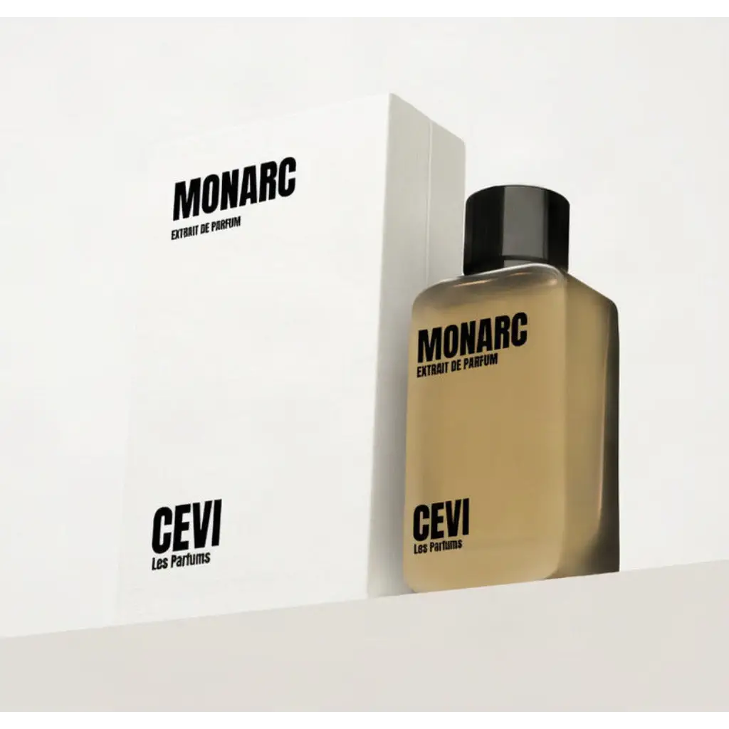 A sleek rectangular amber glass bottle of monarc extrait de parfum by cevi les parfums with matte black cap and minimalist branding