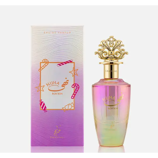 A shimmering pink and green gradient glass perfume bottle with ornate gold cap labeled nuha bon bon khadlaj edp 85ml