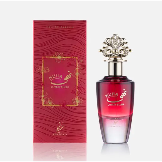 Elegant red and clear glass perfume bottle with gold ornate cap labeled nuha cherry blush by khadaj edp 85ml