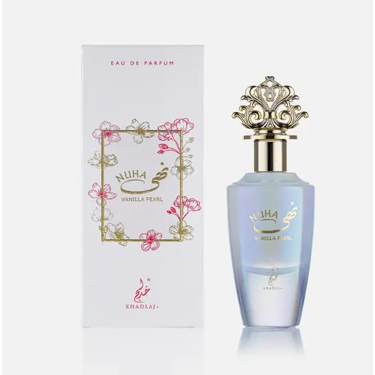 A delicate light blue glass perfume bottle with ornate gold cap and floral branding for nuha vanilla pearl khadlaj edp 85ml