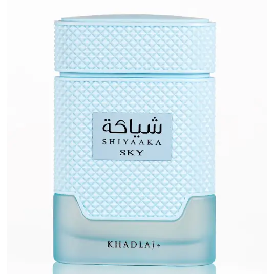 Light blue textured glass perfume bottle with matching cap labeled shiyaaka sky by khadlaj edp 100ml special edition