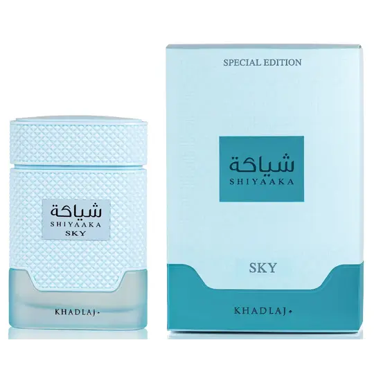 Light blue textured glass perfume bottle with cap labeled shiyaaka sky by khadlaj for edp 100ml special edition