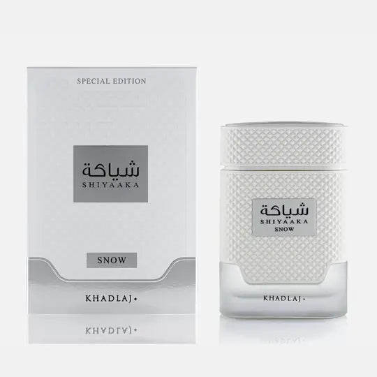 White textured glass perfume bottle with silver cap and label featuring shiyaaka snow fragrance by khadlaj edp 100ml special edition